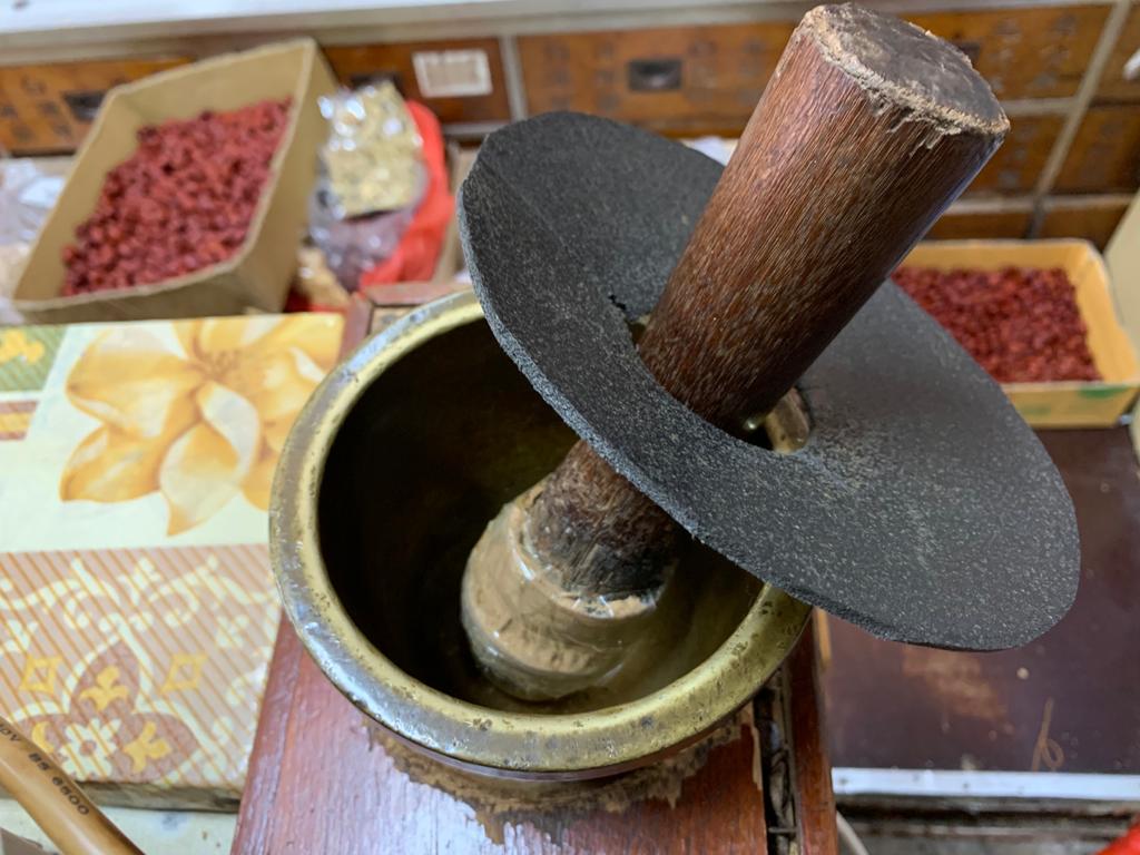 <strong>“Bandaged” pestle and mortar</strong> used to grind herbs into fine powder for easier consumption, in use since 1957.